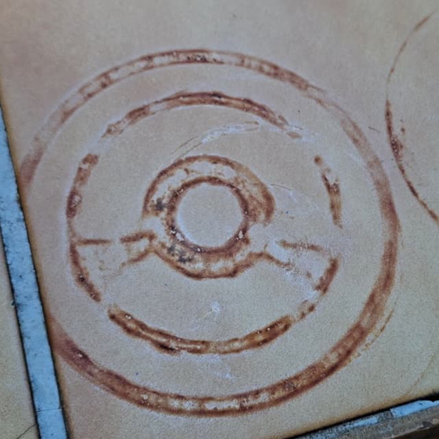 Floor tile with dark ring stains